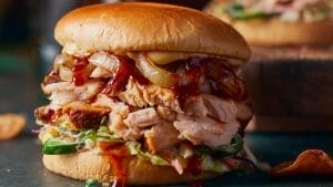 Classic sweet honey barbeque glazed chicken sandwich with Boar's Head sandwich recipes, featuring lettuce and tomato.