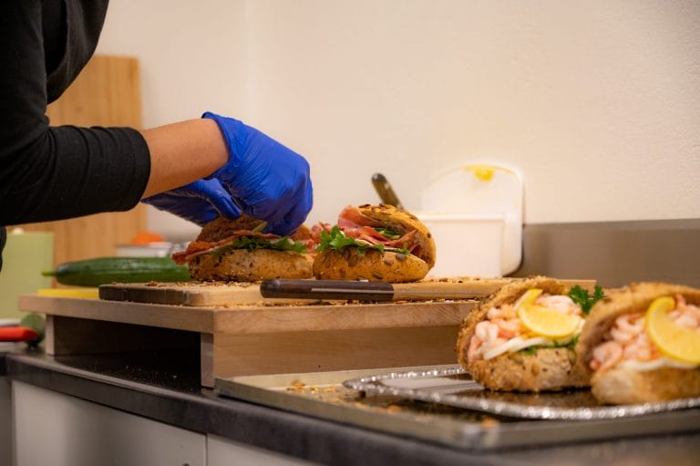 Sandwiches being prepared by a food service business